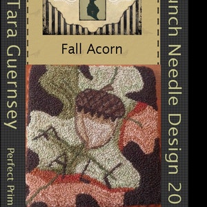 Puede incluir: Un patrón de diseño de aguja de punzón que presenta una bellota rodeada de hojas. El patrón se llama "Fall Acorn" y mide 10 cm por 10 cm. El patrón es de Tara Guernsey y forma parte de la colección Perfect Prim Punch.