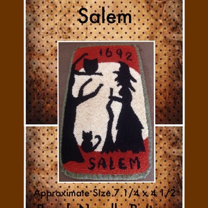 May include: A punch needle pattern featuring a witch and cat silhouette with the text "Salem 1692" and "Salem" on a red background. The pattern is approximately 7 1/4 inches by 4 1/2 inches.