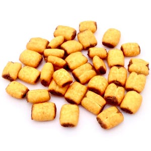 May include: A collection of golden-brown, rectangular pastries with a dark brown filling, presented against a white backdrop. The pastries, some split open, are well-lit, emphasizing their textures and colours. The image focuses on the food.