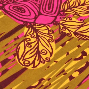 May include: Close-up of a fabric with a vibrant, abstract design. The pattern features large, stylized floral elements in hot pink and yellow, outlined in dark brown. The background has diagonal stripes in olive green and maroon.