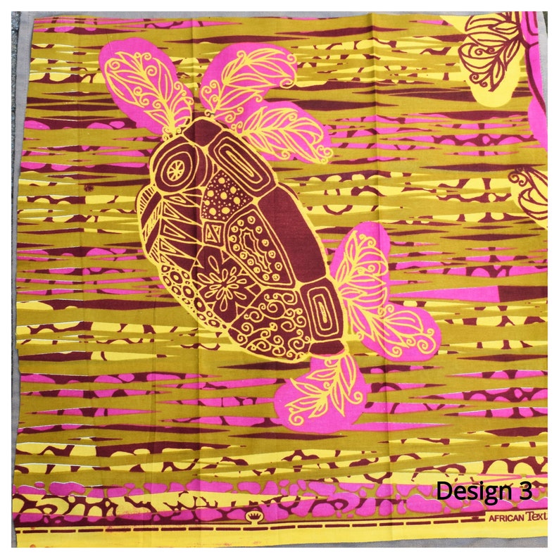 May include: A yellow and pink fabric with a stylized turtle design. The turtle is outlined in yellow and has a brown shell with intricate details. The fabric has a striped pattern and the text "Design 3" and "African Text" are visible at the bottom.