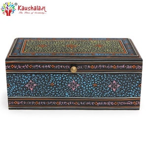 May include: A black wooden box with a floral design painted on the lid and sides. The box has a brass knob on the lid. The box is decorated with intricate floral patterns in shades of blue, pink, yellow, and orange.