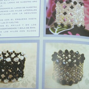 May include: Close-up of a page with instructions and images of beaded rings. The rings are made with clear and black beads, showcasing intricate patterns. The text in Spanish provides guidance on the ring-making process.