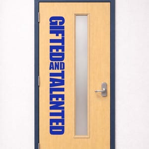 May include: A wooden door with a rectangular glass panel and a silver handle. The door frame is dark blue, and the door has the words "GIFTED AND TALENTED" in blue vertical text.