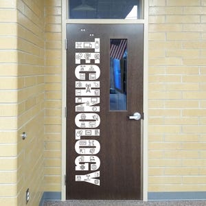 May include: A brown door with the word "TECHNOLOGY" in white capital letters. The word is made up of various white icons related to technology. The door has a small window with an American flag visible inside.