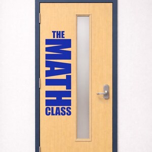 May include: A light wood-toned door with a dark blue frame and a vertical frosted glass window. The door features a silver metal kick plate and a silver lever handle. Blue vinyl lettering on the door surface reads THE MATH CLASS.