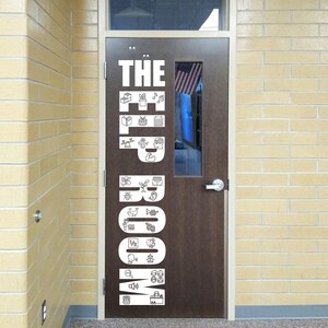 May include: A dark brown door featuring a large white vertical decal that reads THE ELP ROOM. The letters are filled with various small line-art icons representing educational and developmental themes, including books, music, numbers, and symbols.