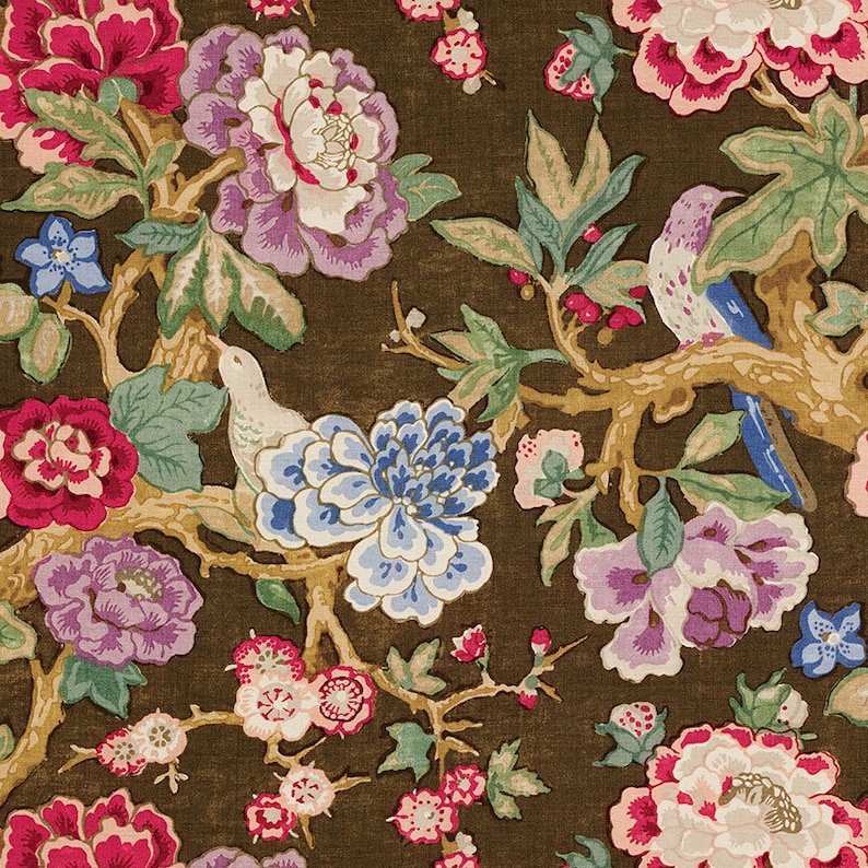 May include: A brown fabric with a floral pattern featuring pink, purple, blue, and white flowers. The fabric also has a pattern of birds and branches.