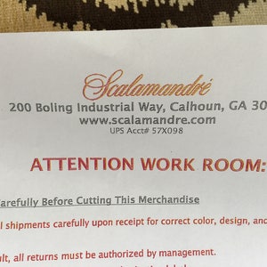 May include: A white document with black and red text featuring the Scalamandr&eacute; logo at the top. The text includes the address 200 Boling Industrial Way, Calhoun, GA 30701, the website www.scalamandre.com, UPS Acct# 57X098, and the heading ATTENTION WORK ROOM: