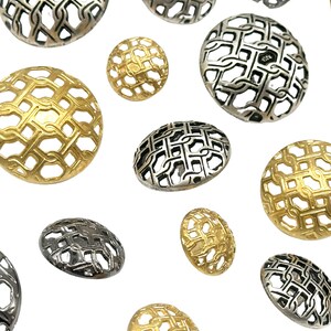 May include: A collection of decorative metal buttons with a geometric pattern. The buttons are in gold and silver tones.