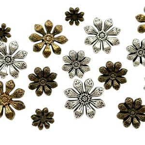 May include: Assortment of silver and gold metal flower-shaped embellishments. The embellishments have a raised design and are perfect for adding a touch of elegance to crafts and jewellery.
