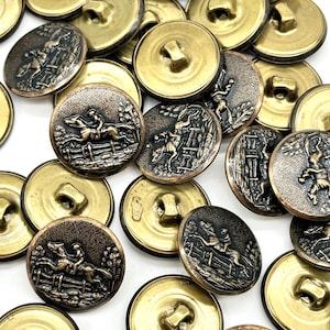 May include: A collection of 18 gold and bronze metal buttons featuring a raised design of a horse jumping over a fence. The buttons have a shiny finish and are perfect for adding a touch of vintage charm to your sewing projects.