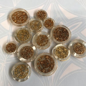 One Package (12 Buttons) Vintage "Steampunk like Metal Embedded in Clear Epoxy" 2 hole Buttons-A6428 from the 1980's and in various sizes