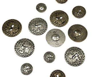 May include: Assortment of metal buttons with various designs and finishes. Some buttons are silver with a textured finish, while others are gold with a smooth finish. The buttons feature a variety of geometric and abstract designs.
