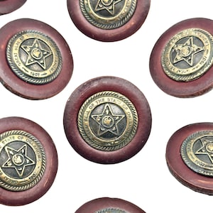 May include: Six round, brown leather buttons with gold metal accents. Each button features the Great Seal of the State of Oklahoma, with a five-pointed star and the words "Great Seal of the State of Oklahoma" and "1907".