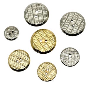 May include: Assortment of seven decorative buttons with a woven pattern. The buttons are in two colours: gold and silver.