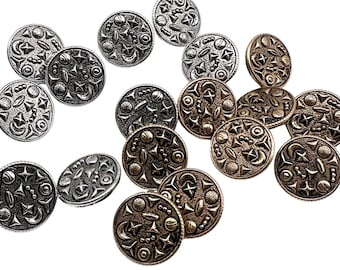May include: A collection of 15 silver and gold-toned metal buttons with a celestial design. The buttons feature a variety of celestial shapes, including stars, moons, planets, and comets.
