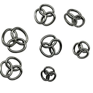 May include: A set of seven silver-toned metal triquetra charms of varying sizes. The charms are in the shape of three interlocking circles.