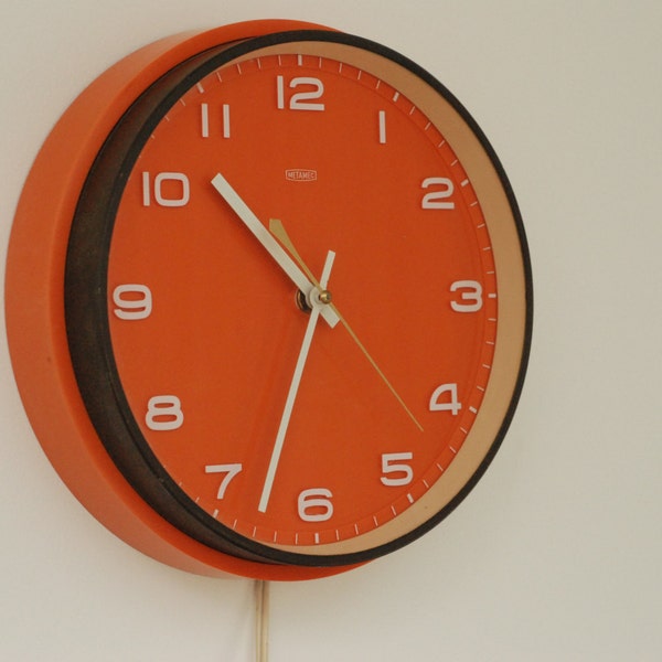 Orange wall clock from Metamec