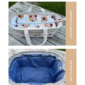 Puede incluir: Un bolso tote gris con forro interior floral y cierre de cremallera. El bolso tiene un interior azul con lunares con m&uacute;ltiples bolsillos y sin cierre. El bolso tiene dos asas.