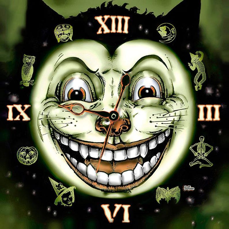 May include: A wall clock featuring a large, grinning cat face with glowing green skin, wide eyes, and prominent teeth. The clock face displays Roman numerals XIII, IX, III, and VI, surrounded by small illustrations of an owl, pumpkin, and skeleton.