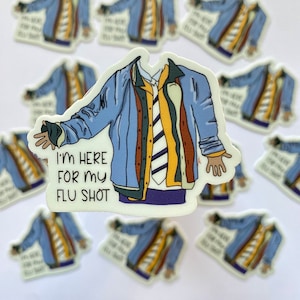 May include: A sticker featuring a cartoon illustration of a person wearing a blue jacket, a white shirt with a yellow and black striped tie, and purple pants. The person is holding out their arms and the text "I'm here for my flu shot" is written below them.