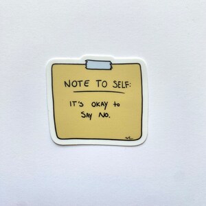 May include: A yellow sticky note with the text "Note to self: It's okay to say no."