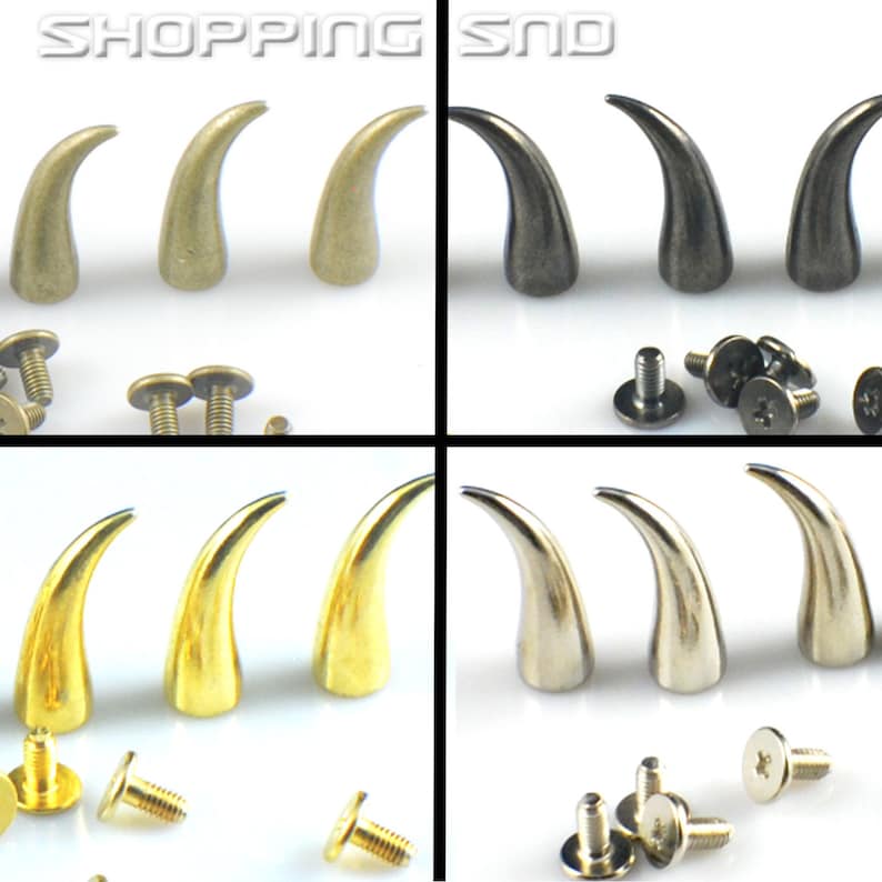 K&ouml;nnte beinhalten: Vier S&auml;tze mit jeweils drei hornf&ouml;rmigen Metallnieten mit Schrauben. Die H&ouml;rner sind in Gold, Silber, Antikgold und Schwarz.