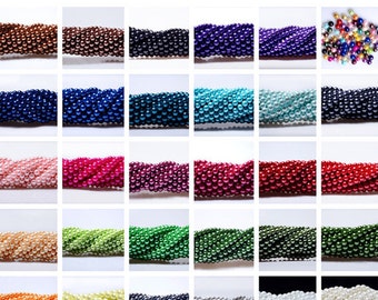 May include: Assortment of 24 strands of pearl beads in various colors, including white, black, green, blue, pink, and orange. Each strand is approximately 6mm in diameter.