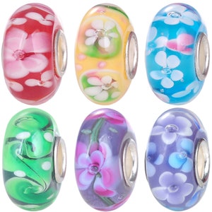 May include: Six colorful glass beads with floral designs. The beads are round and have a silver metal spacer. The beads are in various colors, including red, yellow, blue, green, purple, and pink.