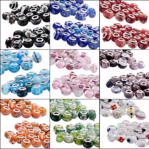 May include: Assortment of 10 different colors of glass beads with silver metal accents. Each bead has a hole for stringing. The beads are arranged in a grid pattern.