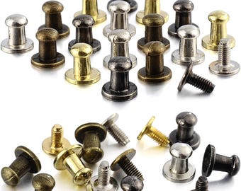 May include: A collection of metal furniture tacks in various finishes, including gold, silver, and black. The tacks have a round head with a raised center and a threaded shank.