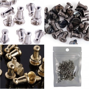 May include: Assortment of metal furniture tacks in silver, gold, and black finishes. The tacks have a round head and a screw-on base. The tacks are packaged in a clear plastic bag with a white label that says "RUBYCA".
