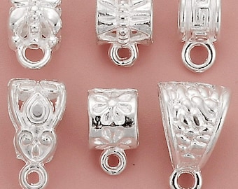 May include: Six silver-toned metal pendant clasps with various decorative designs. The clasps have a loop at the bottom for attaching to a necklace or bracelet.