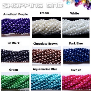 May include: Assortment of pearl beads in various colors, including amethyst purple, cream, white, jet black, chocolate brown, dark blue, green, aquamarine blue, and fuchsia.