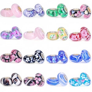 May include: Set of 10 pairs of glass beads with various floral and swirl patterns. The beads are in shades of pink, blue, green, yellow, and white.