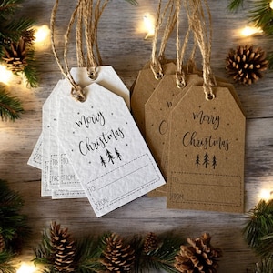 May include: Set of six gift tags with a rustic design. The tags are made of brown and white cardstock and feature the text "Merry Christmas" with a small illustration of pine trees. Each tag has a space for writing "To:" and "From:".