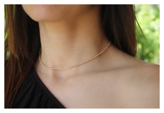 Dainty gold beaded necklace sale