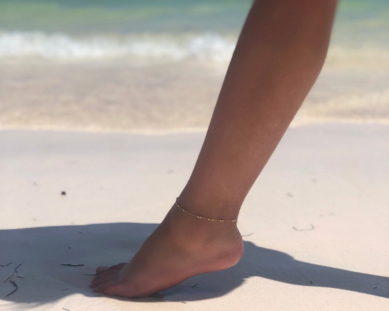 Gold Filled chain with beads anklet on the beach.