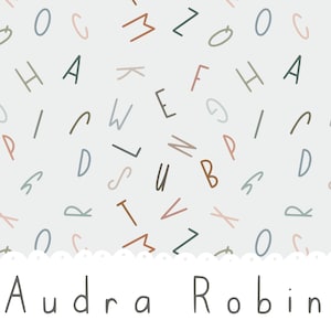 May include: A light blue background with a pattern of colorful letters. The letters are in a variety of fonts and sizes. The text "Audra Robin" is at the bottom of the image.