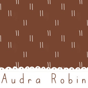 May include: A brown background with a white repeating pattern of double vertical lines. The bottom of the image has a white scalloped border with white dots. The text "Audra Robin" is written in white below the border.