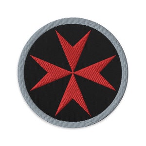 May include: A red Maltese cross embroidered on a black background with a grey border. The cross is a symbol of the Knights of Malta.