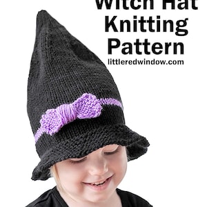 May include: A black knitted witch hat with a purple bow. The hat is worn by a child with a black shirt and a pumpkin in their hands. The text "Halloween Witch Hat Knitting Pattern" and "littleredwindow.com" is visible in the image.