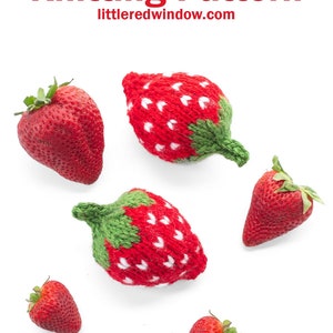May include: Six knitted strawberries, three red and three green, with white stitching, on a white background. The image includes the text "Strawberry Knitting Pattern" and "littleredwindow.com".