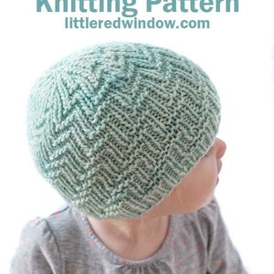 May include: A child wearing a light green knitted hat with a woven zig zag pattern. The hat is made with a gradient yarn that transitions from a darker green to a lighter green. The hat is titled "Woven Zig Zag Hat Knitting Pattern" and includes the website "littleredwindow.com".