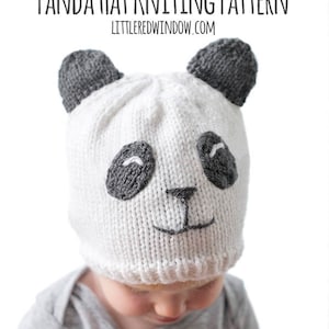 May include: A white knitted hat with a panda face design. The hat has black ears and eyes, a black nose, and a black mouth.