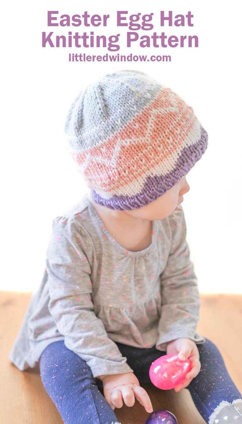 little girl wearing pink purple and blue easter egg patterned knit hat and looking off to the right