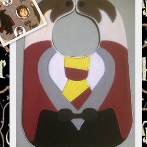 May include: A red, gray, and black baby bib with a tie and bow tie design. The bib has the words "Harry Potter" on it.