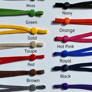 May include: Assortment of 12 colors of elastic mask strap extenders with adjustable toggles. Colors include moss, green, gold, taupe, red, brown, grey, navy, orange, hot pink, royal blue, and purple.
