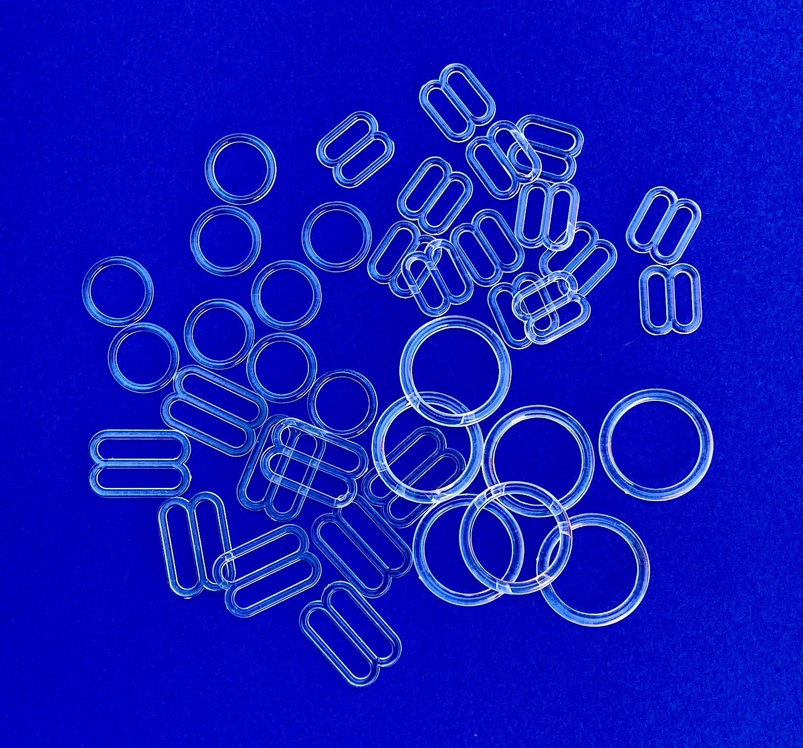 Clear Plastic adjusters in 3/8" or 5/8" Clear Plastic Adjusters - Each set Includes Sliders & Rings